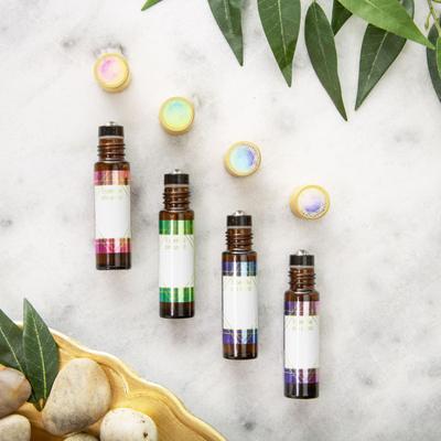 Our customizable roller bottle labels with a signature watercolor design on amber glass bottles.