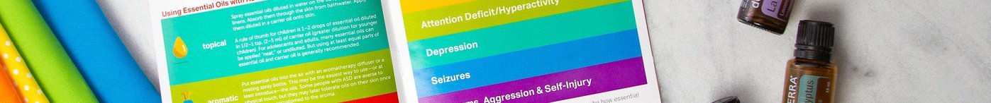 A close up of one of the pages in the "Essential Support for Autism" booklet with some essential oil vials.