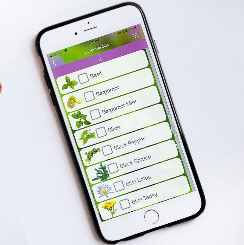 A white phone open to the "Essential Oils" section of the Modern Essentials Plus app.